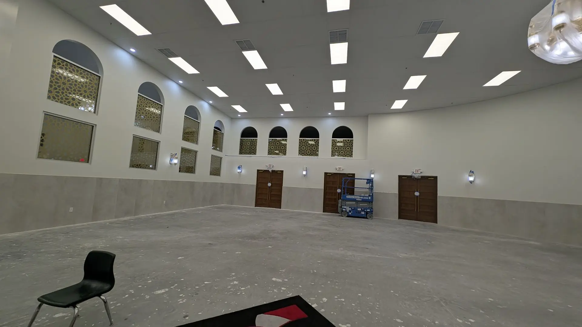 Interior prayer hall area with bare concrete on the floor mid construction